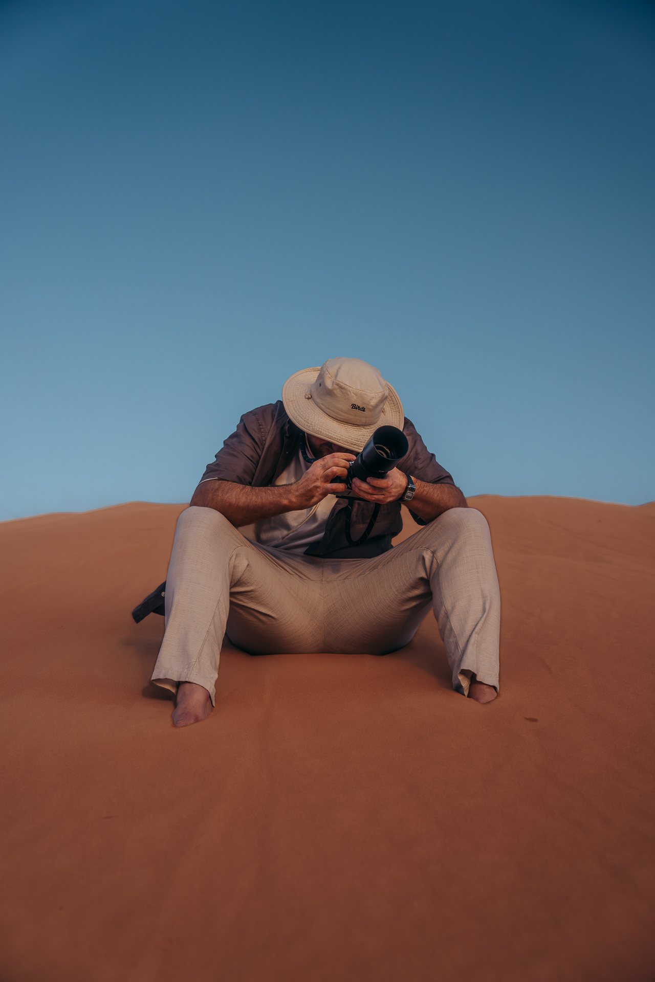 Ben Wood shooting on a dune at blue hour, Oman
